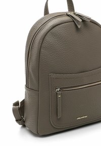 Gray textured leather backpack with front zip pocket, dual zipper closure, top handle, and adjustable shoulder straps.