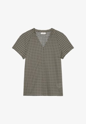 Blouse à manches courtes avec motif floral géométrique noir et beige et col en V, étalée à plat sur fond blanc.