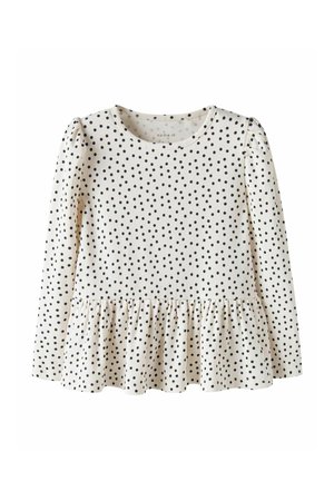 Langärmliges cremefarbenes Oberteil mit schwarzen Punkten, rundem Ausschnitt und gerafftem Peplum-Saum in der Taille.