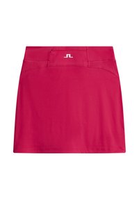 Rosa atletisk kjolshort i elastisk tyg, med en slank design, justerbar midja och en liten logotyp på midjebandet.