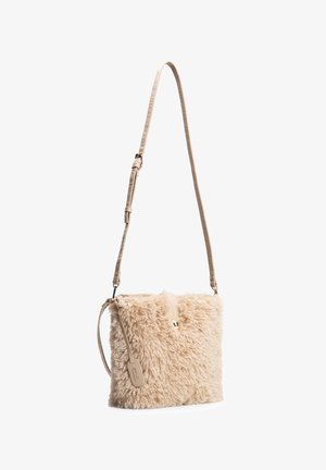 Beige faux fur crossbody bag with adjustable strap and small leather tag, closed with a single metallic snap button.