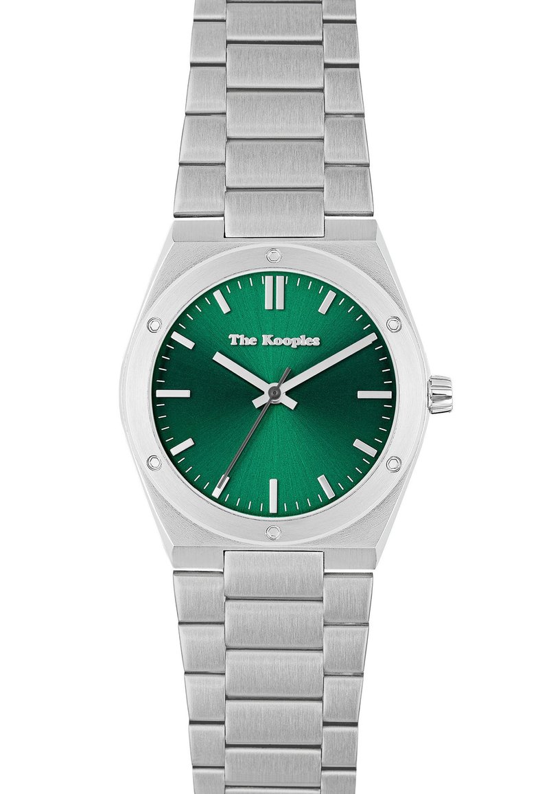 Zegarek ze stali nierdzewnej z zieloną tarczą, srebrnymi wskaźnikami godziny i fakturowaną powierzchnią. Posiada wypolerowaną ośmiokątną lunetę oraz bransoletę z ogniw.