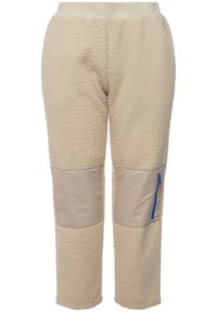 Beige Fleece gefütterte Hose mit strukturierter Oberfläche, ausgestattet mit beigen Stoffflicken auf den Knien und einer blauen Reißverschlusstasche auf der rechten Seite.