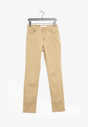 Jeans skinny en mélange de coton beige avec taille mi-haute, cinq poches et design épuré. Comprend un bouton en métal robuste et une fermeture éclaire.