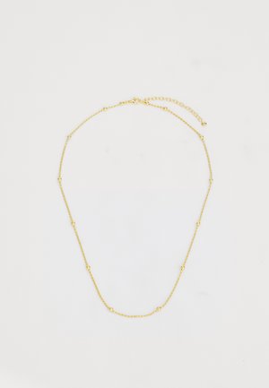 Collana in metallo color oro con design torcido e piccoli accenti di perle rotonde, lunghezza regolabile con chiusura a gancio.