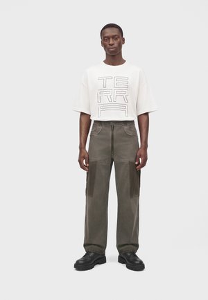 Atelier de roupa, INDUSTRIAL PANTS UNISEX - Карго панталони - black