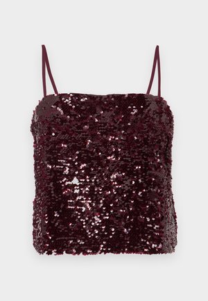 Haut bordeaux à sequins avec fines bretelles spaghetti ; forme rectangulaire avec une coupe légèrement ample ; texture brillante grâce à des centaines de petits sequins.