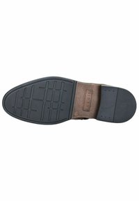 Semelle de chaussure en caoutchouc noir avec un motif de grip texturé et un accent en cuir marron. Présente un logo rectangulaire embossé près du talon.