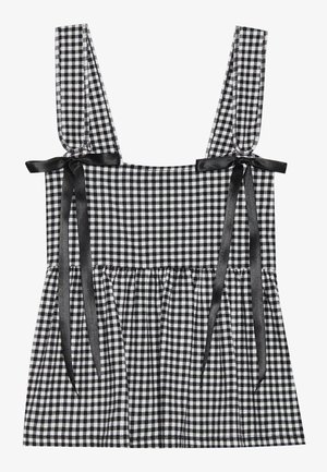 Top in bianco e nero a quadri con spalline larghe, dotato di nastri in raso nero e un orlo arricciato. Tessuto misto cotone.