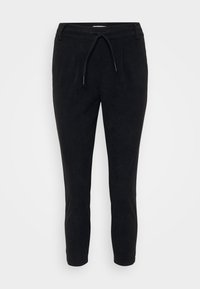 Black corduroy pants with a drawstring waist, tapered legs, and textured surface. Suitable for casual wear.