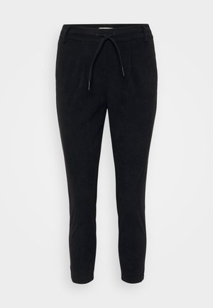 Zwarte corduroy broeken met een trekkoord in de taille, taps toelopende benen en een gestructureerd oppervlak. Geschikt voor casual wear.