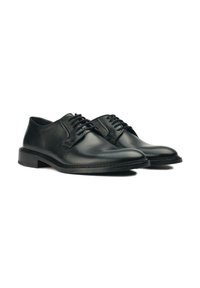 Black leather dress shoes with a smooth finish, rounded toe, five eyelets for laces, and a low, solid heel. Simple stitched detailing.