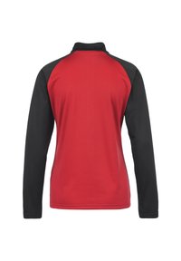 Giacca a maniche lunghe con corpetto rosso e maniche raglan nere, realizzata in tessuto lucido con colletto alto e taglio pulito.