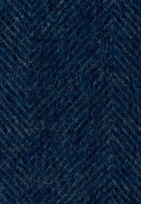 Tela de patrón espiga en azul oscuro con una superficie texturizada, que muestra fibras visibles y una apariencia suave similar a la lana.