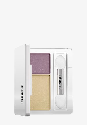 Kompakte Clinique Lidschattenpalette mit zwei schimmernden Farbtönen (Lavendel und Gold) und einem doppelseitigen Schwamm-Applikator.