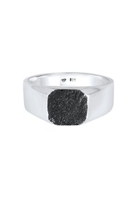 Silver ring with a polished band and a textured black accent on top. The ring is marked "925" for sterling silver authenticity.