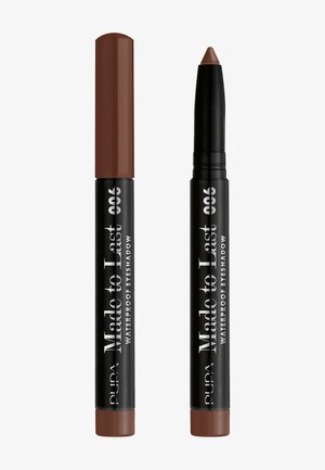 Crayon ombré à paupières brun imperméable avec une pointe arrondie. Boîtier noir avec texte blanc, muni d'un capuchon brun contrastant. Design compact et élégant.