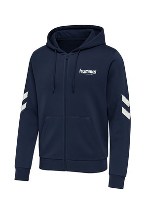 Marineblå zip-up sweatshirt lavet af blødt stof, med et logo foran, to sidelommer og hvide chevron-detaljer på ærmerne. Hætte med snore.