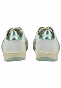 White and gray sneakers with a smooth leather upper, suede accents, mint green heel detail, and textured rubber soles.