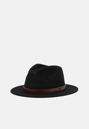 Black wide-brim felt fedora hat with a brown leather band and small buckle detail against a light gray background.