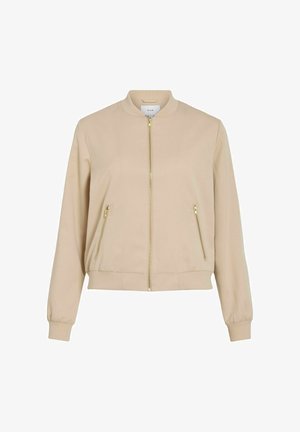 Beige bomberjack met een ritsluiting, twee voorkant ritszakken, ribgebreide manchetten en een ronde kraag. Gladde stoftextuur.