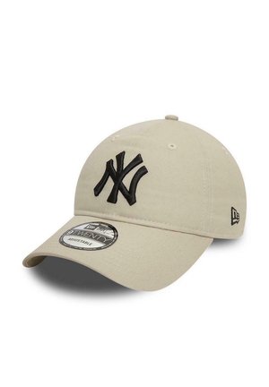 Beige cap with a curved brim and embroidered black NY logo. Features adjustable strap and a branded tag on the underside of the brim.