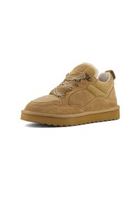 Tan suede sneaker with thick patterned laces, ribbed textile panels, fleece lining, and a serrated rubber sole.