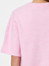Light pink short-sleeve sweater with a ribbed texture and a rounded neckline, featuring a soft, fuzzy finish.