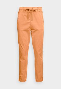 Calças laranja claro com cintura elástica e cordão, pernas ajustadas e bolsos laterais. Feitas de um tecido leve e suave com um acabamento limpo.