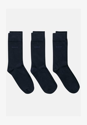 Conjunto de calcetines de algodón azul marino, con una textura suave y puños acanalados. Cada calcetín tiene el logo "GANT" en un contraste de azul claro.