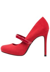 Red suede Mary Jane high heel with a glossy strap, rounded cut-out toe, and a stiletto heel. Smooth texture with vibrant color.