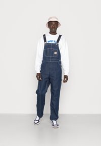 Carhartt WIP BIB OVERALL - Laisvo kirpimo džinsai - blue one wash