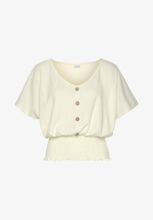 Kremkrāsas blūze ar V veida kakla izgriezumu, īsām piedurknēm, pieciem koka pogām priekšpusē un teksturētu, savilkta apakšmalu.