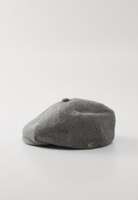 Gray wool cap with a rounded shape, curved brim, subtle stitching details, and a small decorative emblem on the side.