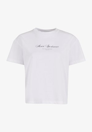 Valkoinen puuvillapaita, jossa on pyöreä pääntie. Keskellä rintaa musta logo, jossa lukee "Alim' Sportswear". Lyhyet hihat.