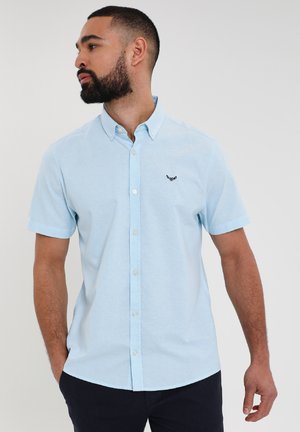Lichtblauwe shirt met korte mouwen van katoen, met een button-down kraag en geborduurd logo op de linkerborst, in een relaxed fit.