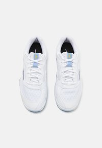 White athletic shoes with mesh and synthetic upper, light blue accent, yellow logo, round toe, and contrasting black insole.