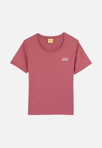 T-shirt à manches courtes et col rond en coton mauve avec un petit logo blanc sur la zone de la poitrine gauche. Texture lisse, design décontracté.