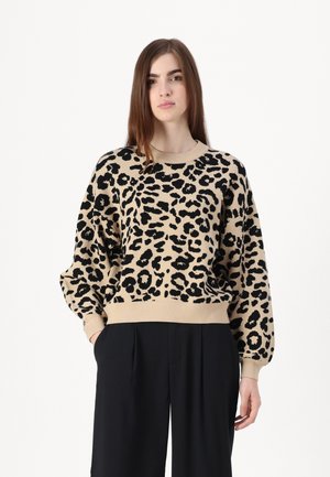Beige pullover with black leopard print, featuring a crew neck, relaxed fit, and ribbed cuffs and hem. Soft knit fabric.