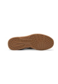 Sola de borracha castanha com padrão de aderência texturizado; apresenta o logótipo da Reebok em destaque. Design elegante, apropriado para uso atlético ou vestuário casual.