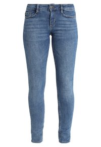 Úzké modré džíny z denimu se středním pasem, pětiprvkovým designem kapes a jemným vyblednutím. Hladká textura s klasickým zipem a knoflíkovým zapínáním.