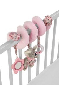 Soft pink plush baby toy set featuring floral accents, with a stuffed animal, reflective flower mirror, and textured rings hanging on a crib railing.