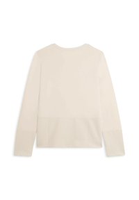 Top de manga larga en beige claro con una sección superior lisa y un patrón acanalado texturizado en el bajo, con un cuello redondo clásico.