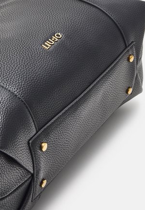 Black textured leather handbag with gold hardware accents, featuring the brand name "LIU JO" prominently displayed on the front.