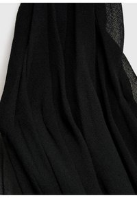Black chiffon fabric drapes in soft, flowing folds, featuring a lightweight, sheer texture and subtle variations in opacity.