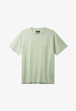 Jasnozielona, bawełniana koszulka z krótkim rękawem i okrągłym dekoltem, z małym białym uśmiechniętym minionym oczkiem na lewej piersi.