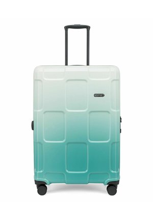 Hardshell suitcase in a gradient of white to teal, featuring a rectangular pattern, extendable handle, and four black wheels for mobility.
