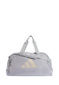 Τσάντα duffel σε ανοιχτό γκρι με λευκές λεπτομέρειες. Διαθέτει μεγάλο λογότυπο, επάνω λαβές, ρυθμιζόμενο ιμάντα ώμου και τσέπη από δίχτυ στο πλάι.