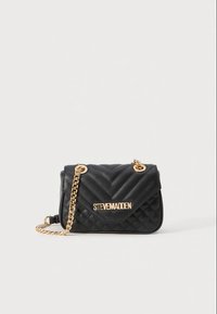 Black quilted handbag featuring a chevron pattern, gold metal chain strap, and logo hardware on the front. Soft texture with a structured shape.