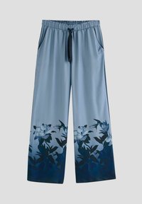 Pantaloni ampi in satin blu chiaro con vita elastica e coulisse. Design floreale in blu scuro all'orlo. Due tasche laterali.